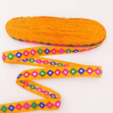 Wholesale Yellow Cotton Fabric Mirrored Trim With Embroidery In Fuchsia Pink, Blue, Red & Green Threads